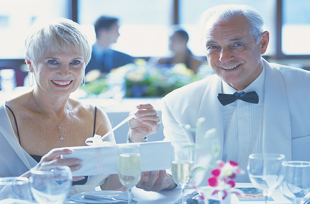 Gentlemen host accompanying a solo cruise guest Cruise Dining experience with a gentleman host