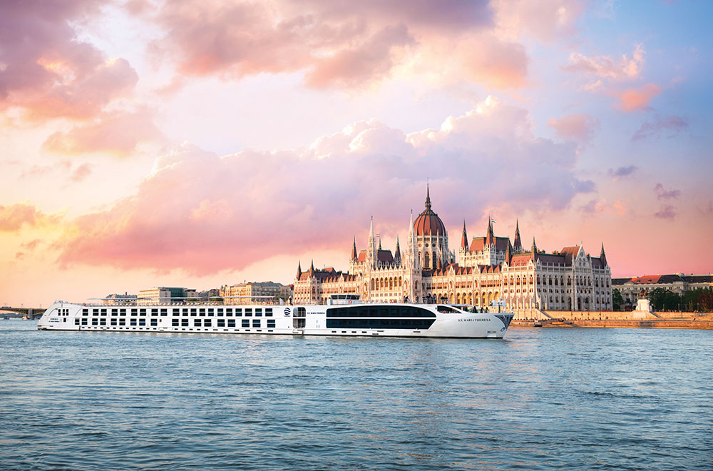Uniworld ship sailing in front of the Hungarian Parliament Building S.S. Maria Theresa sailing across the Danube River