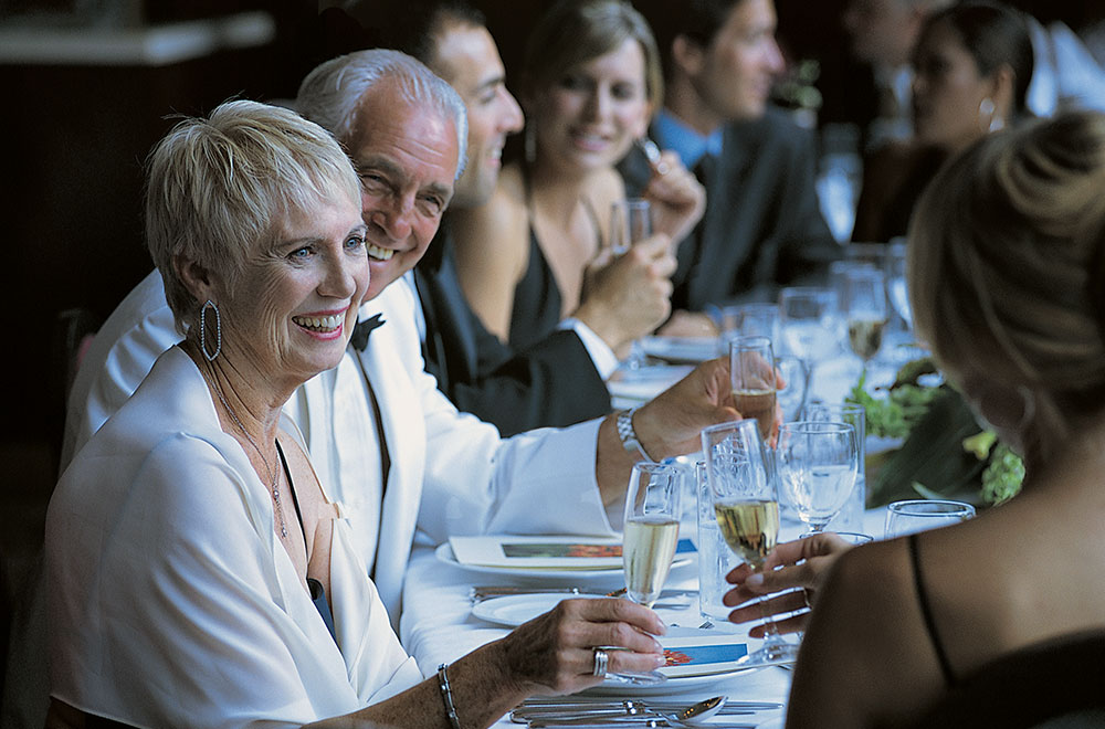 Mature couple having fun in a cruise dining room Senior couple having dinner in a cruise main dining room