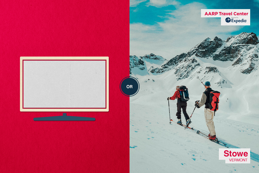 flat screen TV/people skiing on a mountain