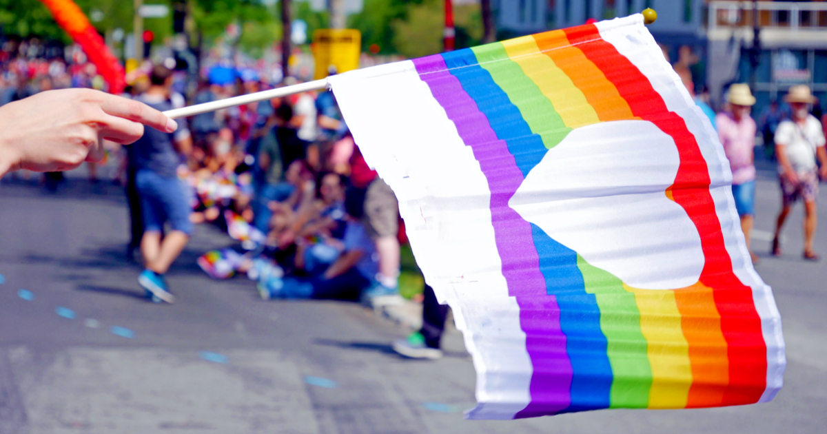 rainbow flag waving at pride parade in montreal, canada